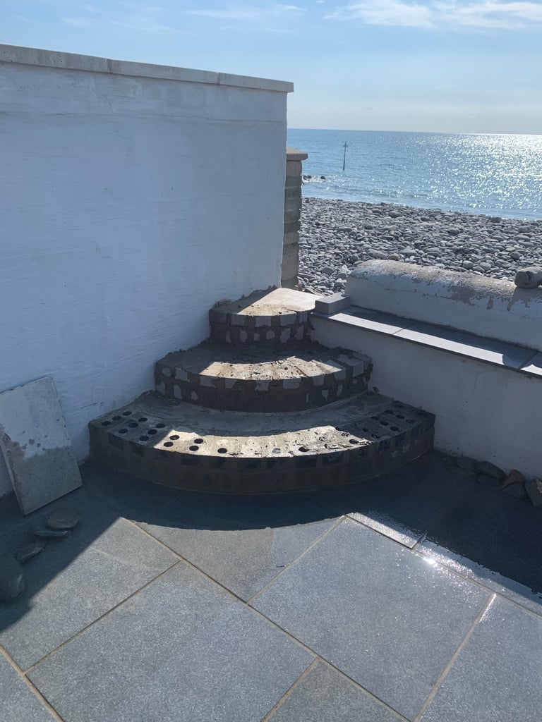 Curved brick steps with sea view