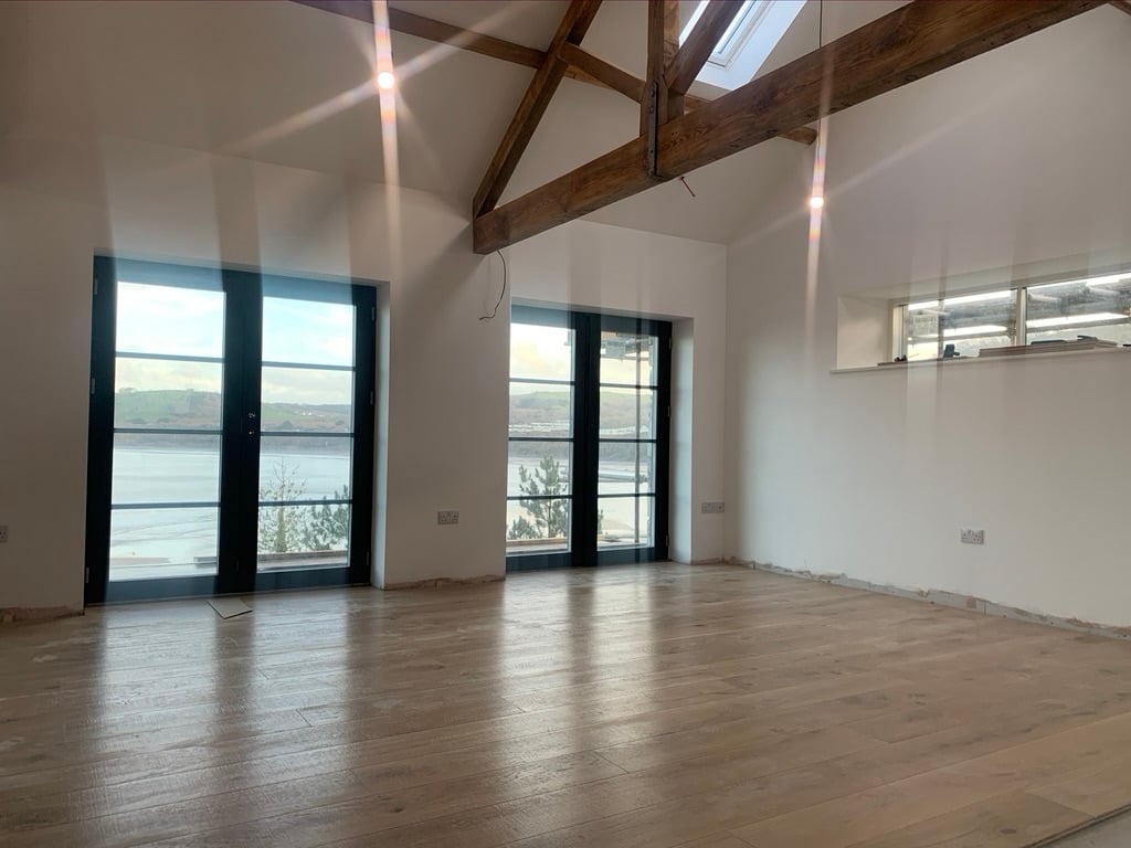 Vaulted ceiling living space with sea views